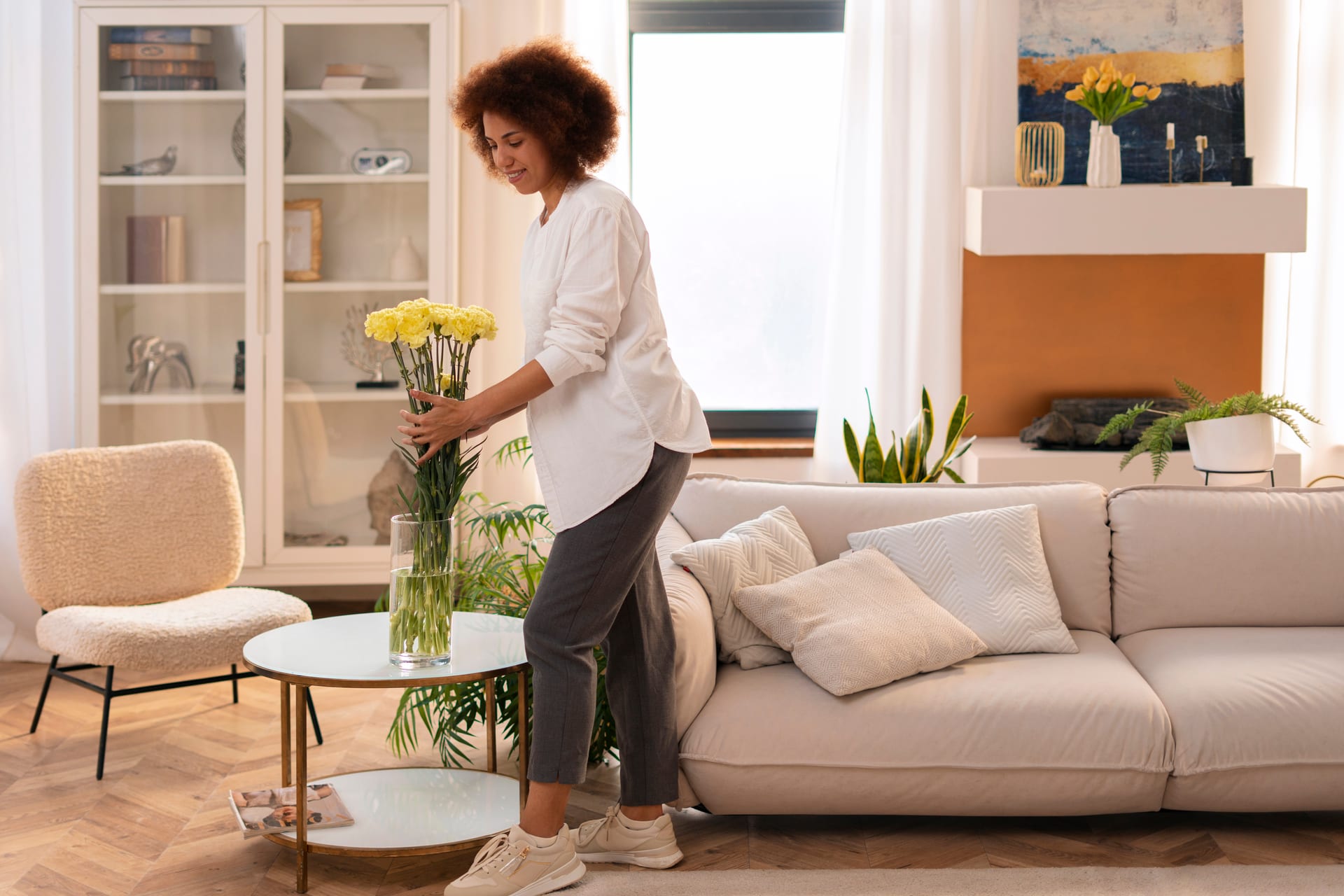Woman enjoying a freshly cleaned living room